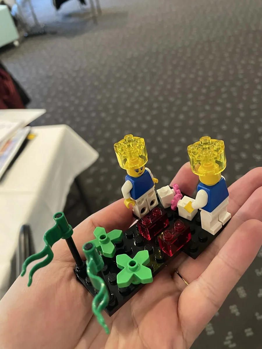 Transparent LEGO bricks held in hand